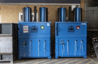 two blue pneumatic balers model 2509