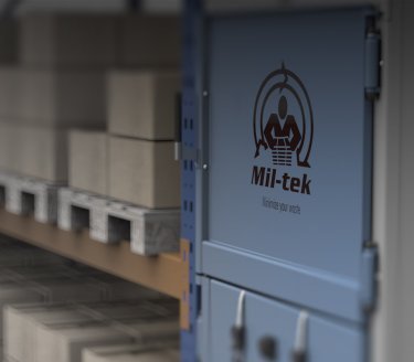 close up of a baler with the text Mil-tek, symbolizing one of several segments