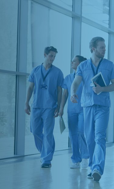 people in hospital walking an aisle