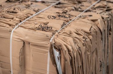 Cardboard bale illustrating the concept of earning money from recycling cardboard