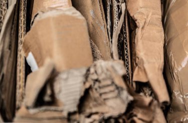 close up of folded cardboard that has been prepared for recycling