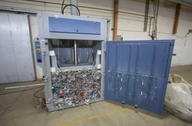 pet bottles compacted to a bale still inside baler chamber