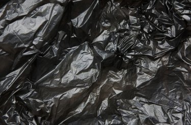 close up of a black mixed waste bag