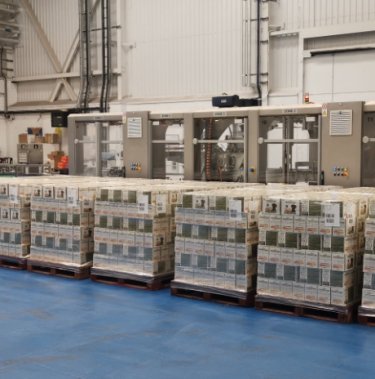 pallets with pet food on blue floor