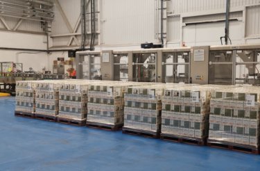 pallets with pet food on blue floor