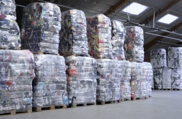 many bales of compacted waste textile