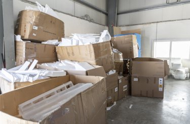 manufacturing waste piled in boxes