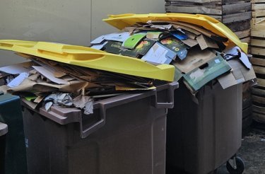 cardboard-waste-in-container-back-of-house-in-retail