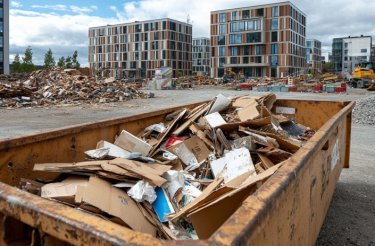 container-with-cardboard-waste-on-building-site