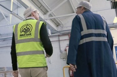 men conducting audit one with yellow west