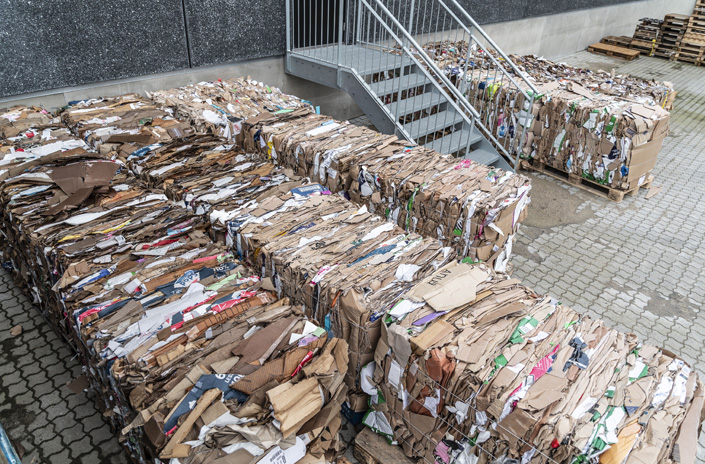 Cardboard bales outside warehouse